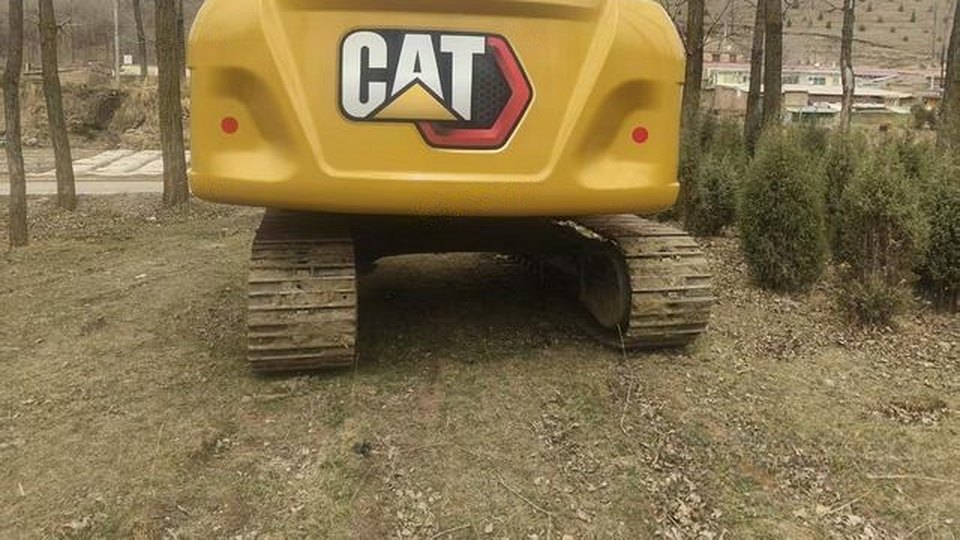 Rear view of a Caterpillar excavator on its tracks