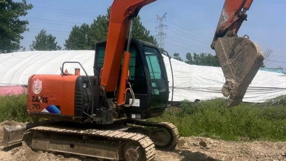 Hitachi ZX70 excavator with its arm raised